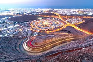 Arabian Peninsula Prints: View from Amirat view point on wavy road in Muscat at blue hour time