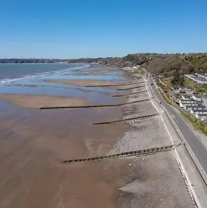 Tides Prints: View of Amroth Beach on the Pembrokeshire coast in winter with very few people