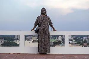 Back View Prints: Back view of a Bangladeshi Muslim woman in a floral abaya and hijab
