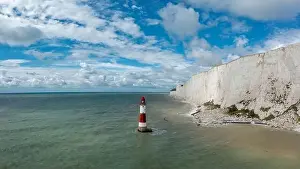 Seven Sisters Prints: view of the Beachy Head Lighthouse in the English Channel with the white cliffs of the Seven Sisters in the background