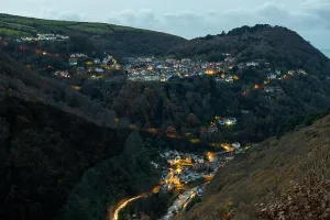 Villages Prints: View from Beacon Tor on Countisbury Hill of Lynton and Lynmouth in Devon at night