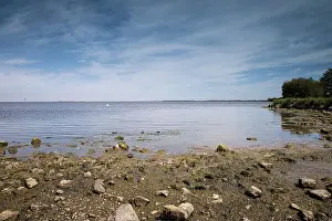 Freshwater Lake Prints: View of the beautiful Lough Neagh from the shore at Oxford Island near Craigavon on a warm sunny spring day with rocks