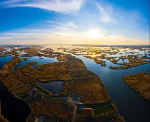 Dnepr Prints: Top view of the beautiful Samarskie Plavni on the Dnieper with a village nearby in the warm evening light
