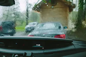 Droplet Prints: View from a car dashboard a rainy day