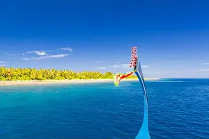 Dhoni Prints: View from the deck of the traditional Maldivian wooden fishing boats on landscape of tropical island with a sandy beach