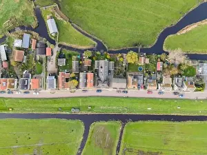 Waterland Prints: Top down view of dike houses and river grass the netherlands Holland natural housing a long the water classic