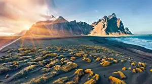 View from flying drone. Amazing autumn sunset on Stokksnes cape with Vestrahorn (Batman Mountain) on background