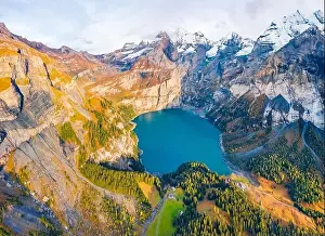 View from flying drone. Attractive autumn view of unique Oeschinensee Lake