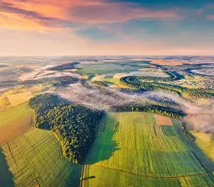 View from flying drone. Attractive morning scene of Ukrainian countryside with field of wheat