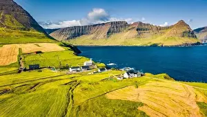 View from flying drone. Bright morning view of Vidareidi Kirkja