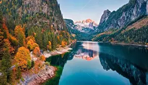 View from flying drone. Captivating autumn view of Gosausee (Vorderer) lake with Dachstein glacieron background