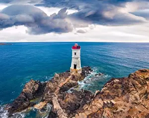 View from flying drone. Dramatic morning view of di Capo Ferro Lighthose