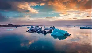 View from flying drone of floating of blue icebergs in Jokulsarlon Glacier Lagoon