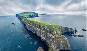Faroe Island Prints: View from flying drone. Gloomy summer scene of Mykines island with old lighthouse