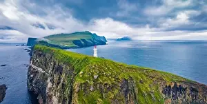 Marvelous Prints: View from flying drone. Gloomy summer scene of Mykines island with old lighthouse