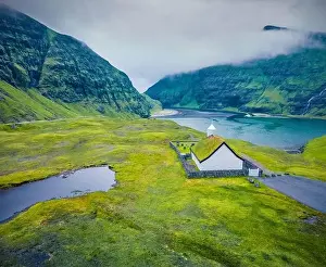 Faroe Island Prints: View from flying drone. Gloomy summer view of Saksun village with Saksunar Kirkja church