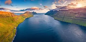 View from flying drone. Gorgeous summer sunrise on Kalsoy island