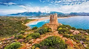 View from flying drone. Impressive summer view of Torre di Porto Giunco tower on Carbonara cape
