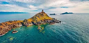 Corse Prints: View from flying drone of popular tourist destination Torra di a Parata - 16th-century Genoese tower reached by a rocky