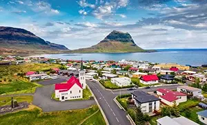 Church Building Prints: View from flying drone. Splendid morning cityscape of Grundarfjordur town with Kirkjufell Mountain on background