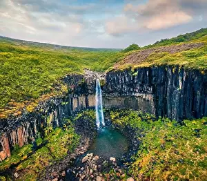 Torrent Prints: View from flying drone. Splendid morning view of famous Svartifoss (Black Fall) Waterfall