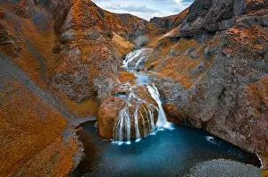 Torrent Prints: View from flying drone of Stjornarfoss waterfall at midnight sun