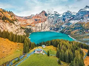 View from flying drone. Stunning autumn view of unique Oeschinensee Lake