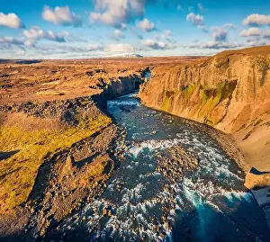 View from flying drone. Sunny summer scene of Skjalfandafljot river