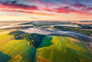 Marvelous Prints: View from flying drone of Ukrainian countryside with field of wheat and foggy valleys