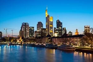 Images Dated 28th April 2016: View of Frankfurt am Main skyline at dusk along Main river with cruise ship in Frankfurt, Germany
