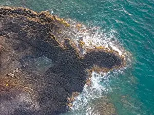 Rocky Beach Prints: View of Ganh Da Dia or Da Dia Reef is a seashore area of uniformly interlocking basalt rock columns located along