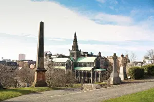 Antiquated Prints: A view across Glasgow's necropolis to Glasgow cathedral and city centre during a cold spring morning in Scotland