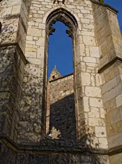 Hannover Prints: View through a Gothic pointed arch window at the Ruins of the Aegidien church in Hanover
