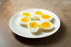 Yolk Prints: A view of halves of 7 minute hard boiled eggs, on a plate