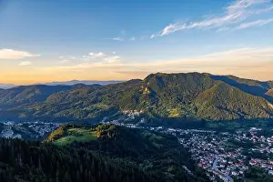 View from high rock to old village Smolyan with green meadows for cattle walking and houses