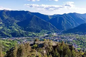 Mountain Town Prints: View from high rock to old village town of Smolyan with green meadows for cattle walking and ancient houses