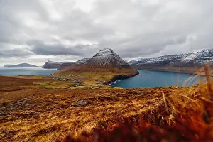 Faroe Islands Prints: View from a hiking path of Kap Enniberg towards the small village Viðareiði and its fjord with snow-covered mountains
