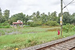 Electrification Prints: view of Indian railway track passing through rural place