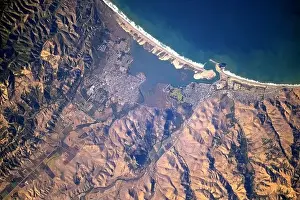 Morro Bay Prints: View from the International Space Station of the huge Morro rock as it casts a shadow on Morro Bay