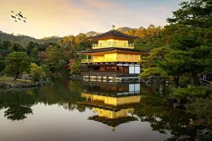 View of Kinkakuji the famous Golden Pavilion with Japanese garden and pond with dramatic evening sky in autumn season at Kyoto, Japan. Japan Landscape