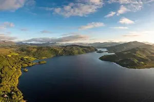 View of Lough Caragh lake in the Glencar Valley of Kerry County in warm eveing light