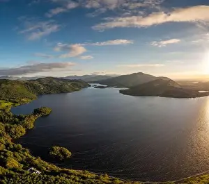 A view of Lough Caragh lake in the Glencar Valley of Kerry County in warm eveing light