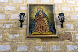 Catholic Religion Prints: View of Mary painting on wall of building in Seville, Spain