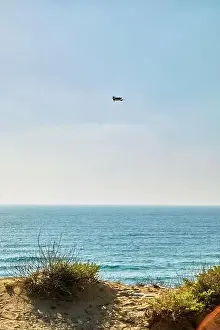 Dron Prints: View of the Mediterranean Sea from the hills at sunset and a flying drone