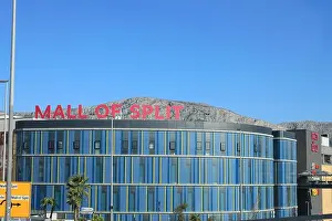 Split Prints: View of modern shopping mall in city under blue sky