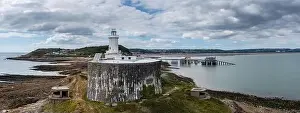 Swansea Prints: View of the Mumbles headland with the historic lighthouse and piers in Swansea Bay