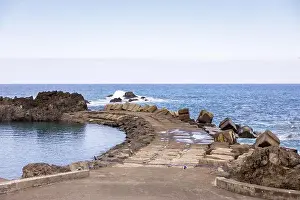 Madeira Island Prints: View of the natural pool and Atlantic Ocean separated by a pier in Seixal