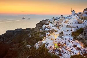 Images Dated 16th June 2011: View of Oia Town and windmills at sunset time, Oia, Santorini Island, Greece