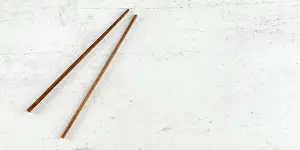 Top Down Prints: Top down view - pair of dark wood chopsticks on white board