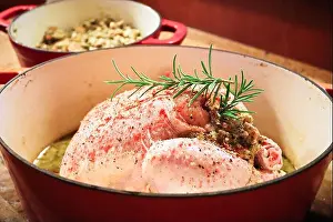 Flesh Prints: Side view of a raw chicken with stuffing in a pot